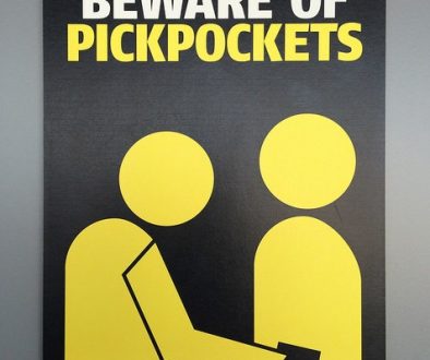 beware of pickpockets sign